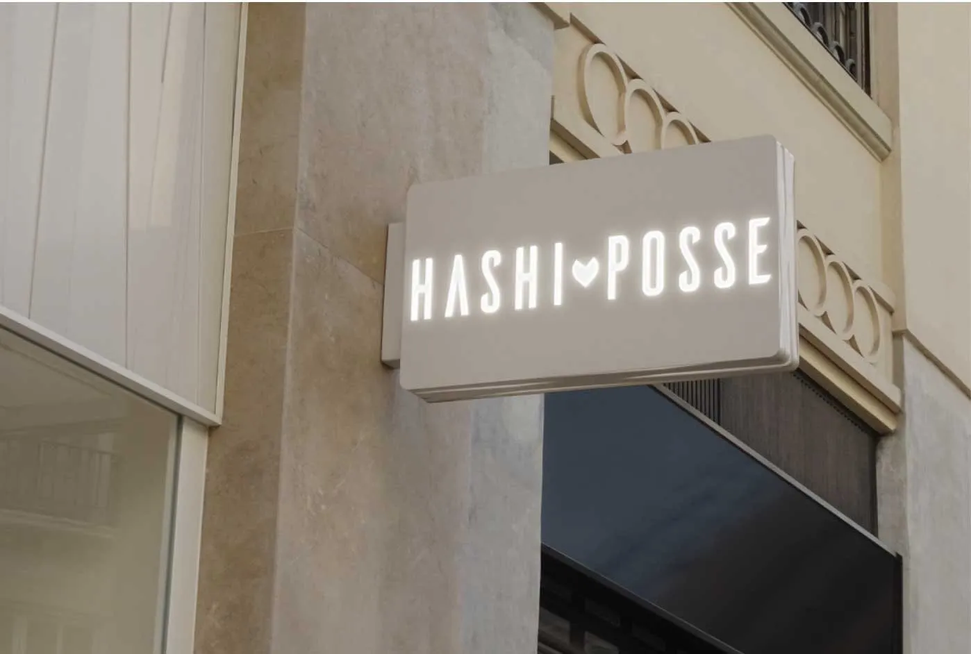 The Hashi Posse wordmark on an illuminated wall sign