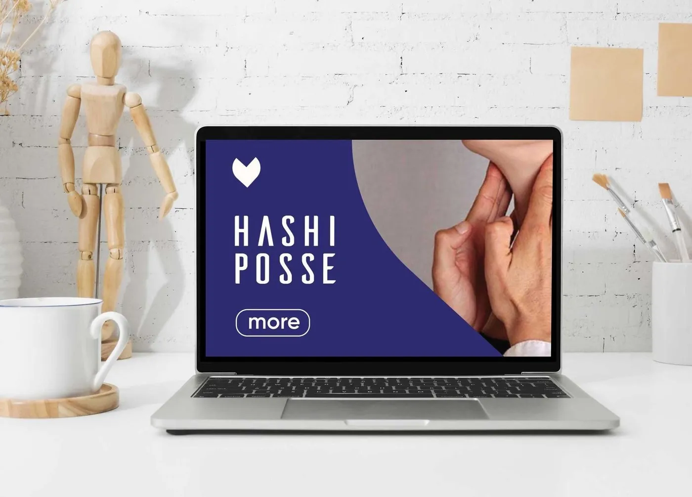 The Hashi Posse website prototype on a laptop